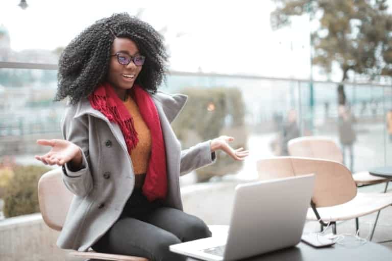 A girl sitting with his laptop
